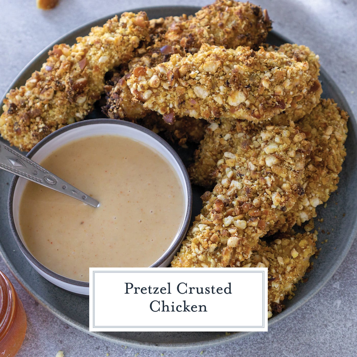 overhead shot of plate of chicken tenders with sauce with text overlay for facebook