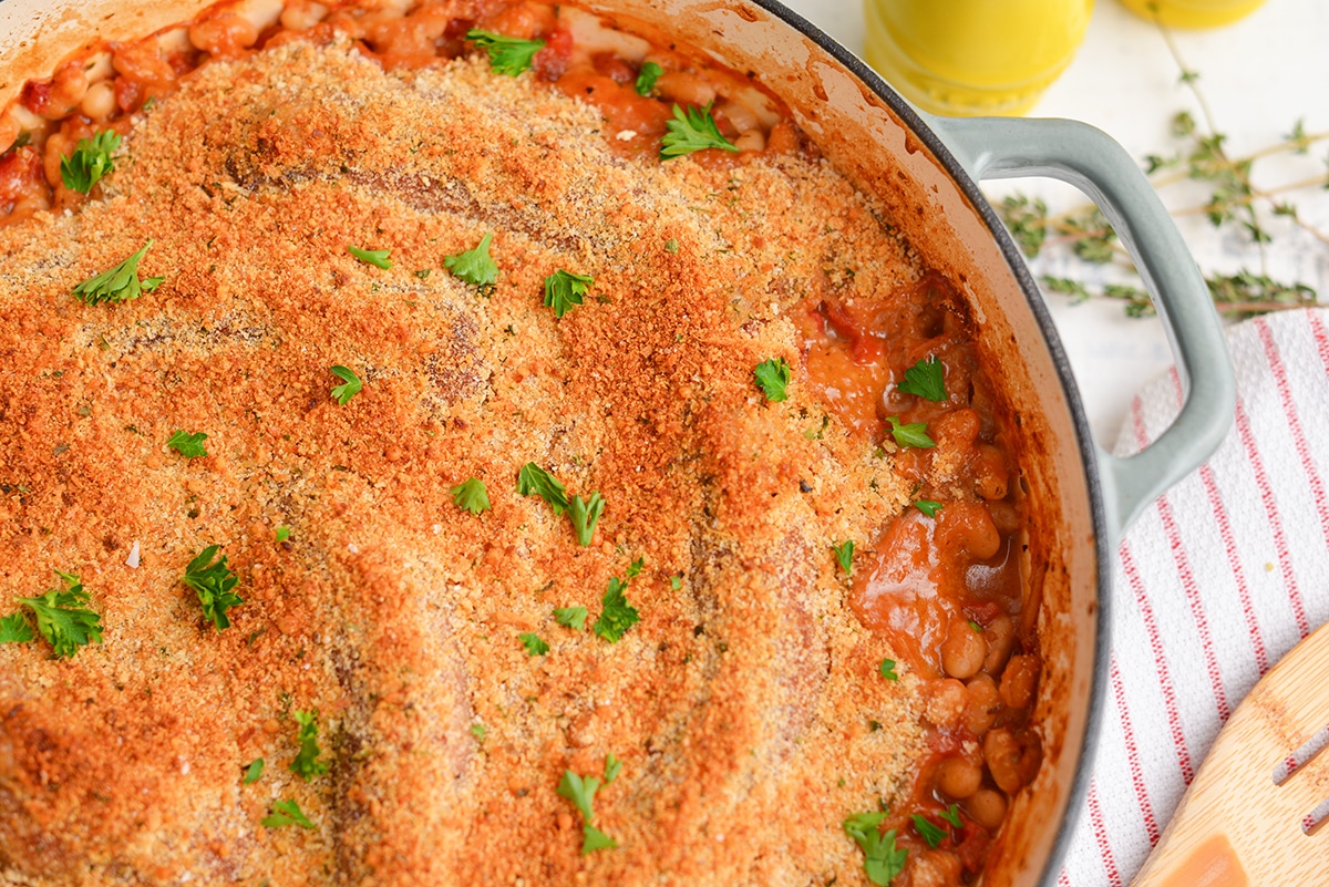 close up of bread crumb topping on white bean cassoulet