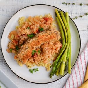 close up of white bean and sausage casserole being served