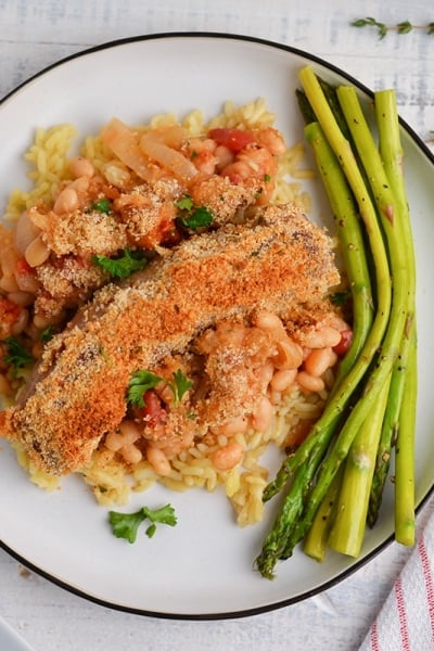 close up of white bean and sausage casserole being served