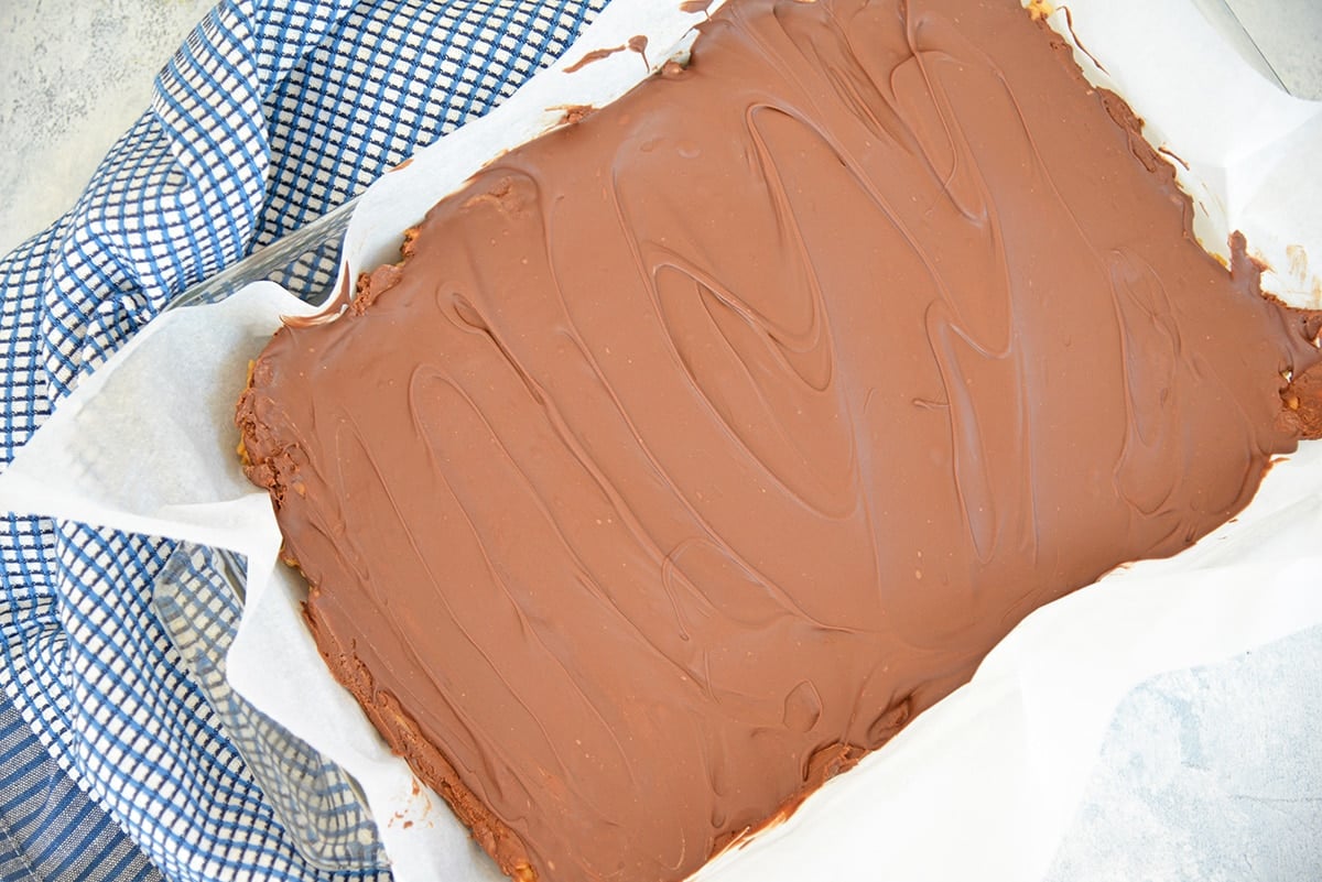 overhead of chocolate spread over scotcheroos