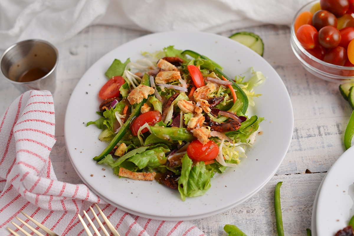 angle view of a side salad with salt and pepper