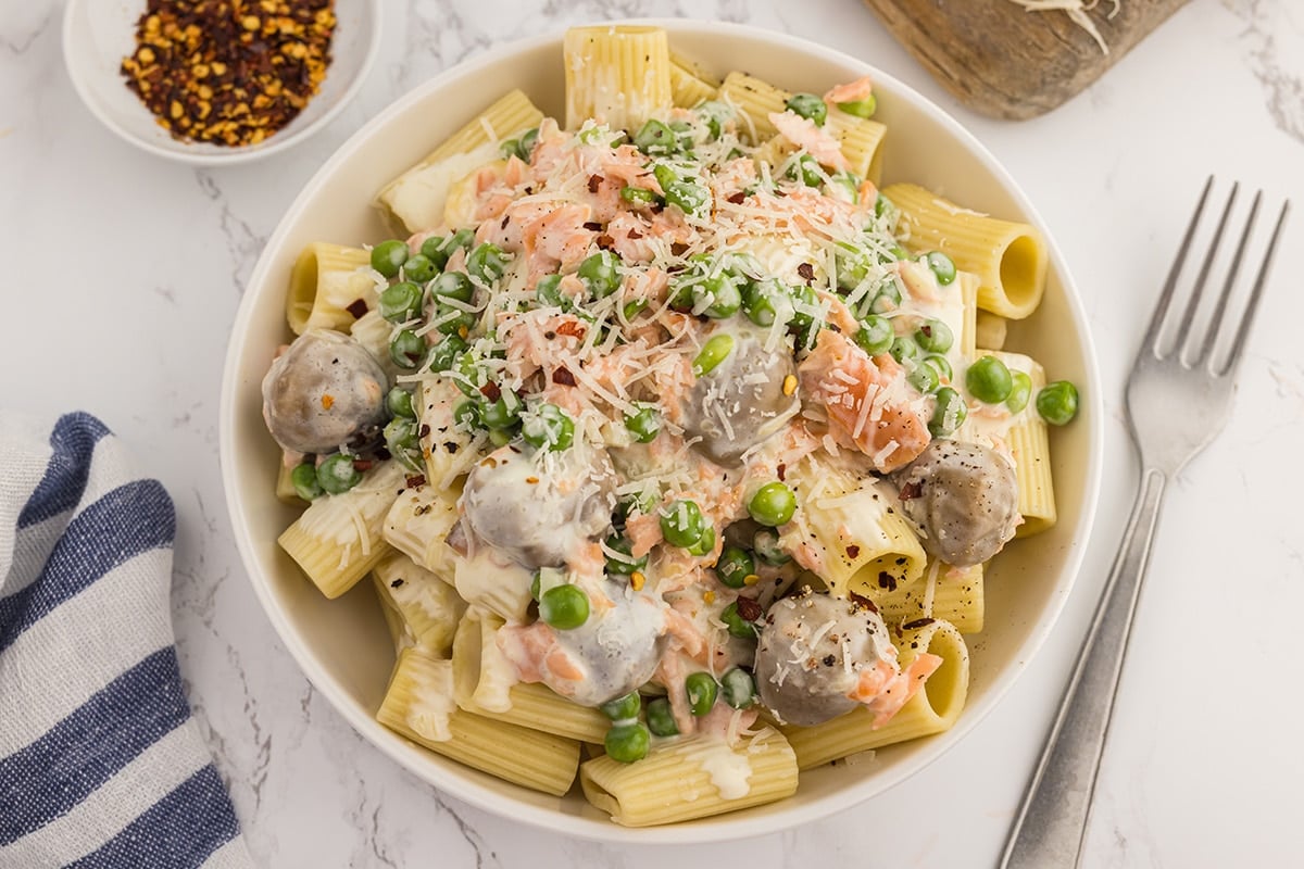 angled shot of smoked salmon pasta in bowl