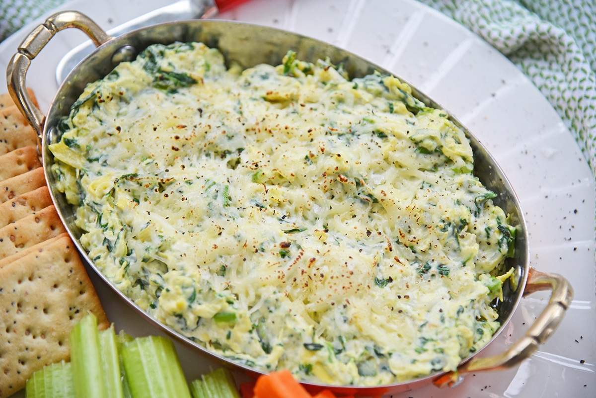 browned cheese on hot spinach and artichoke dip