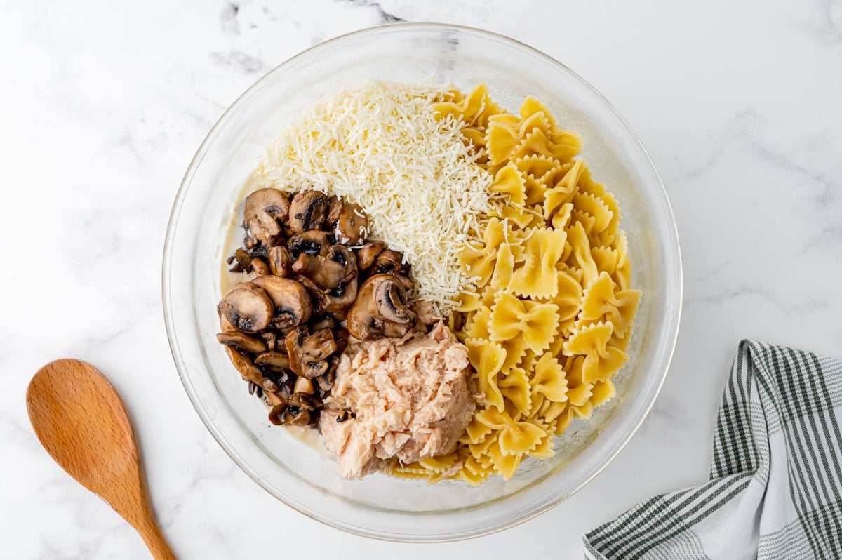 tuna, cheese, pasta and mushrooms in a bowl