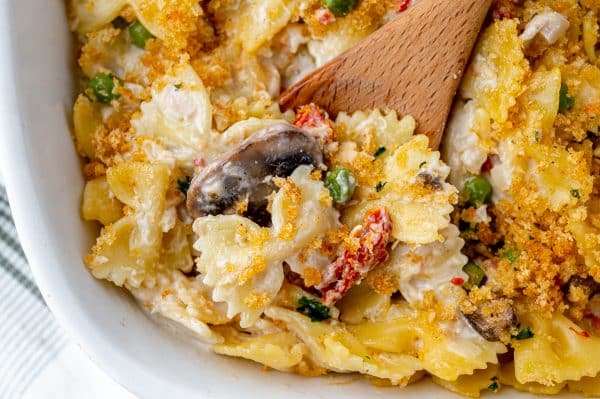 scoop of tuna casserole on wooden spoon
