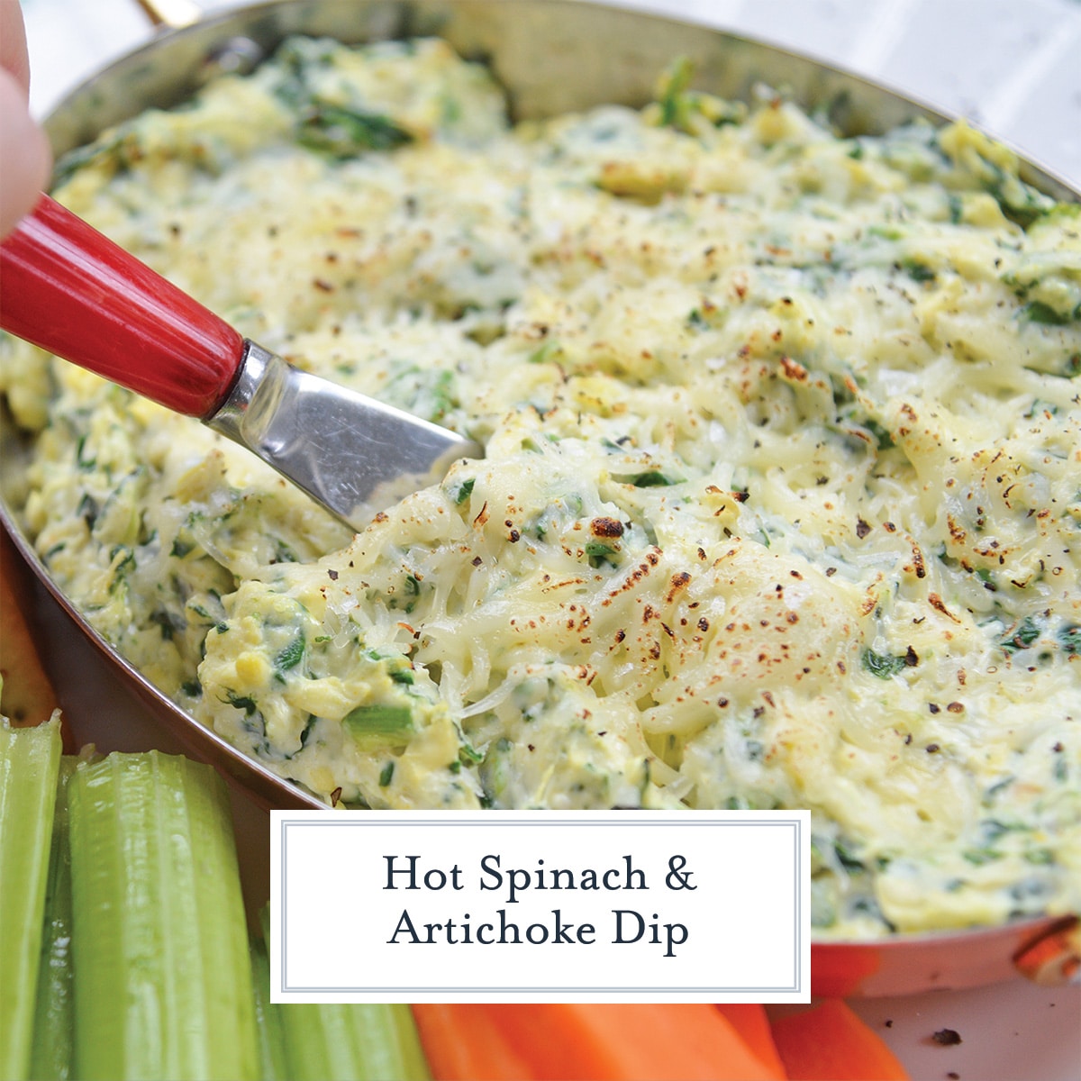 spinach and artichoke dip with celery and carrot sticks
