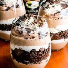 three bailey's cookies and cream parfaits in jars