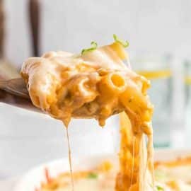 serving spoon full of cheesy casserole