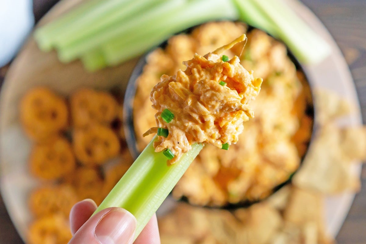 buffalo chicken dip on a celery stick