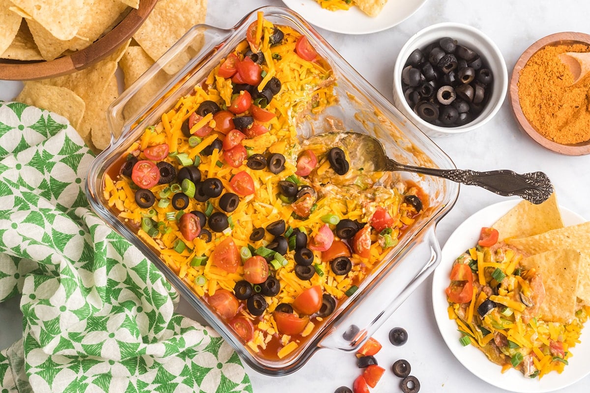 spoon in dish of 7 layer dip