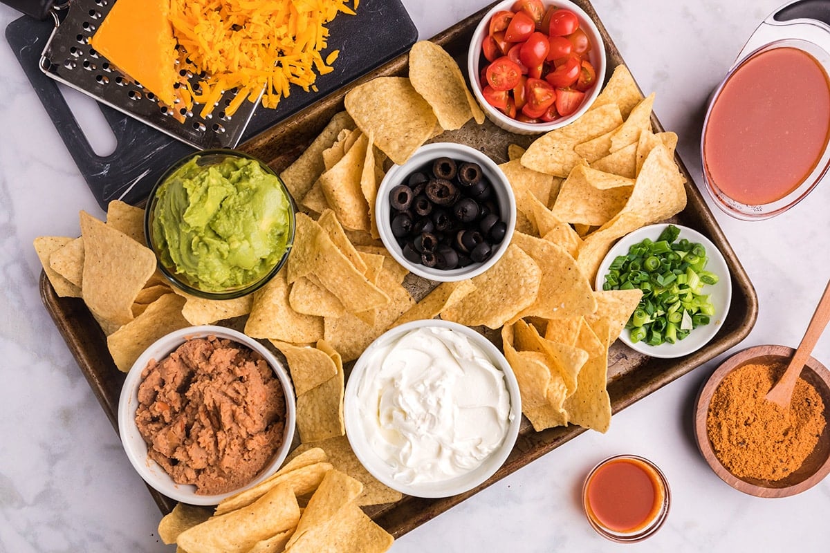 taco ingredients on tray with chips