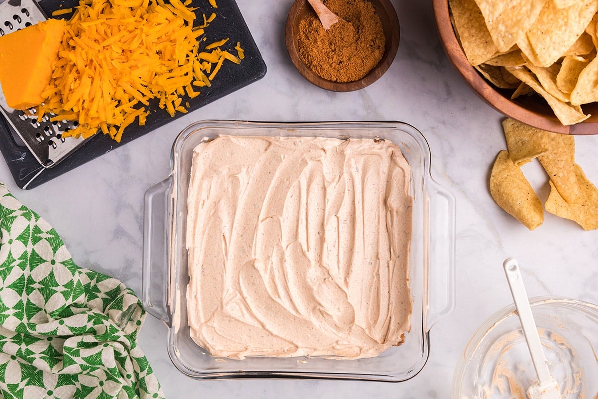 sour cream layer on top of refried beans