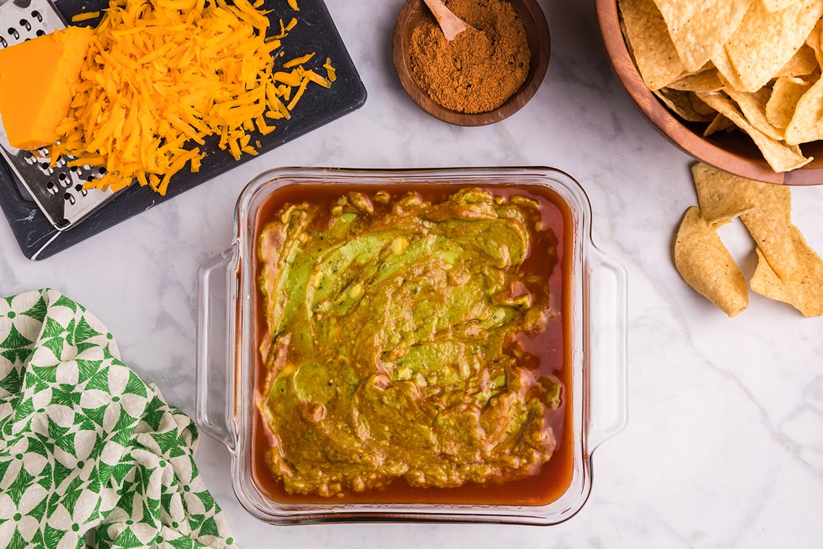 guacamole on enchilada sauce