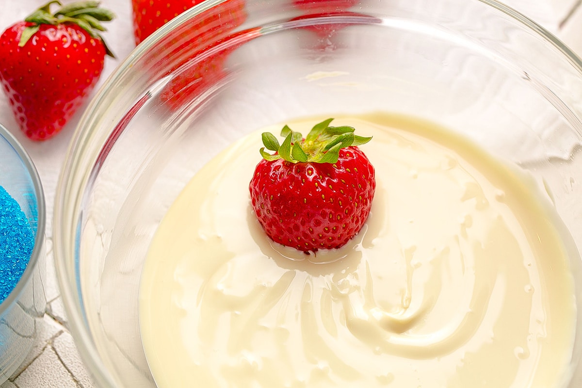 strawberry dipped into white melted chocolate