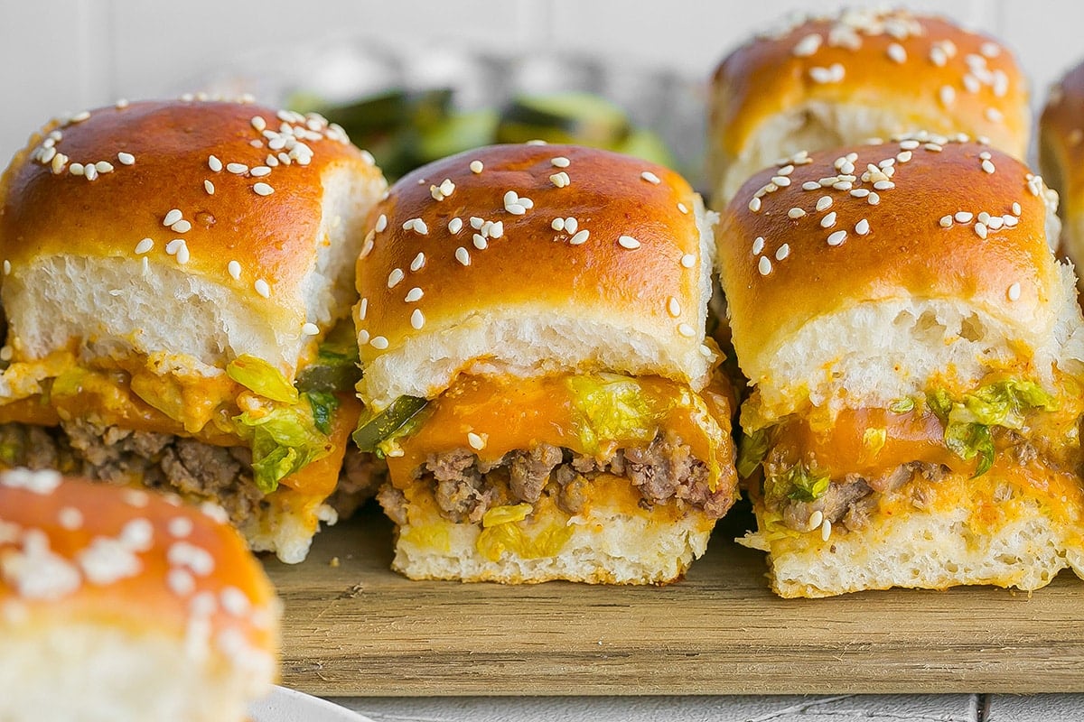 line of three big mac sliders on cutting board