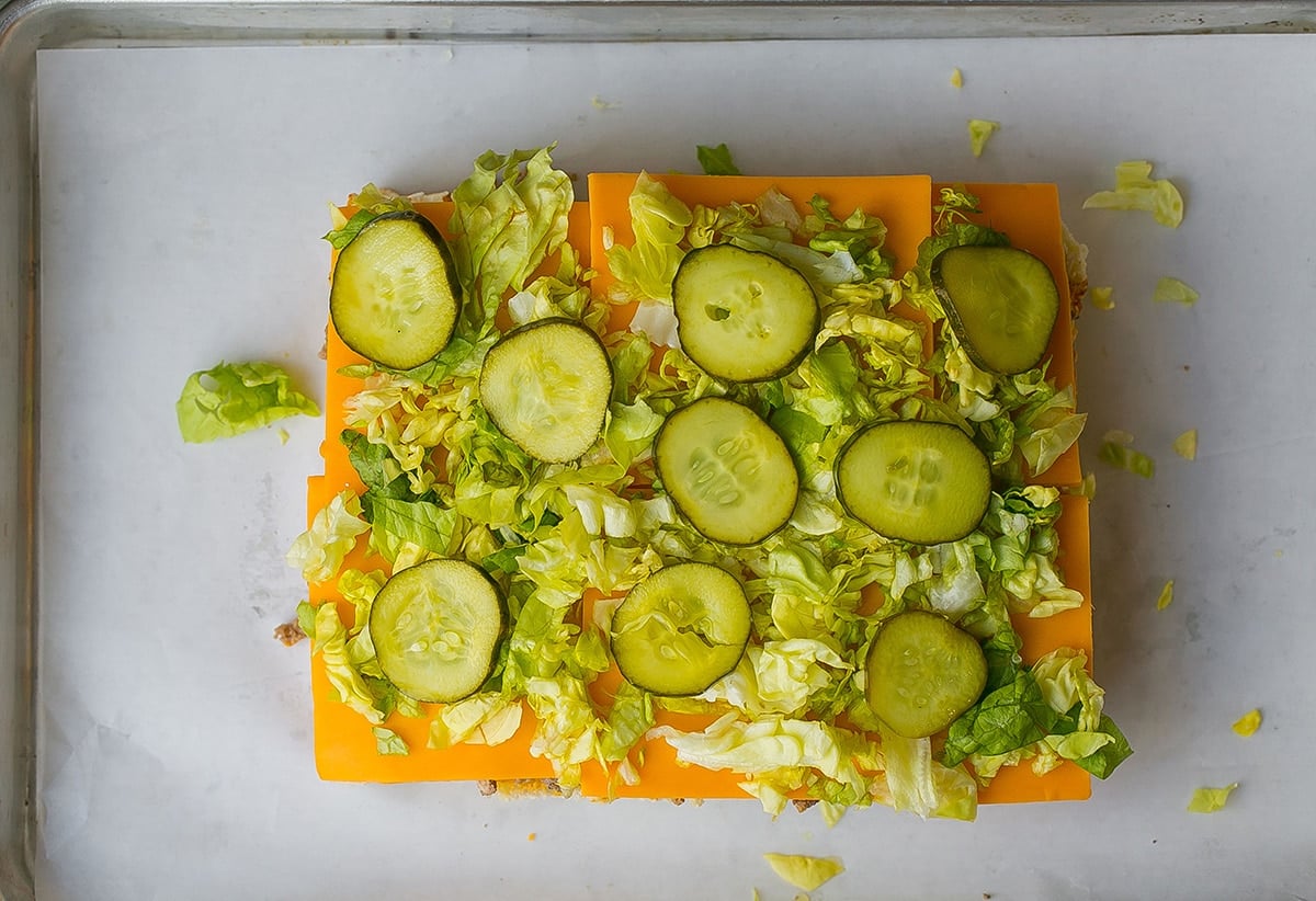 pickles on top of shredded lettuce