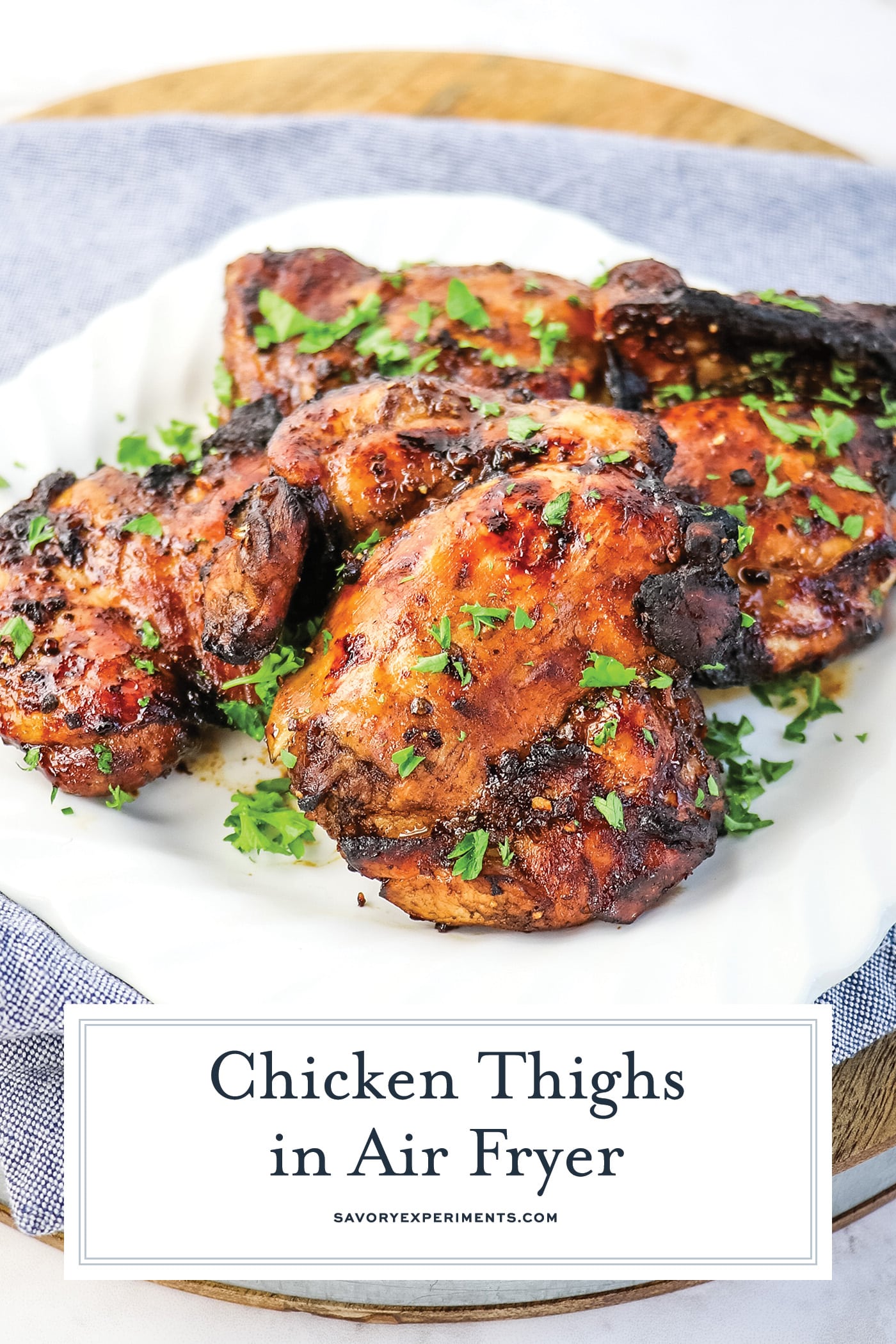 plate of chicken thighs with text overlay for pinterest