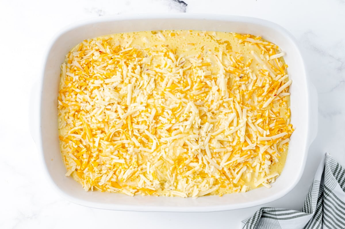 last layer of cheese with egg in a casserole dish for breakfast casserole