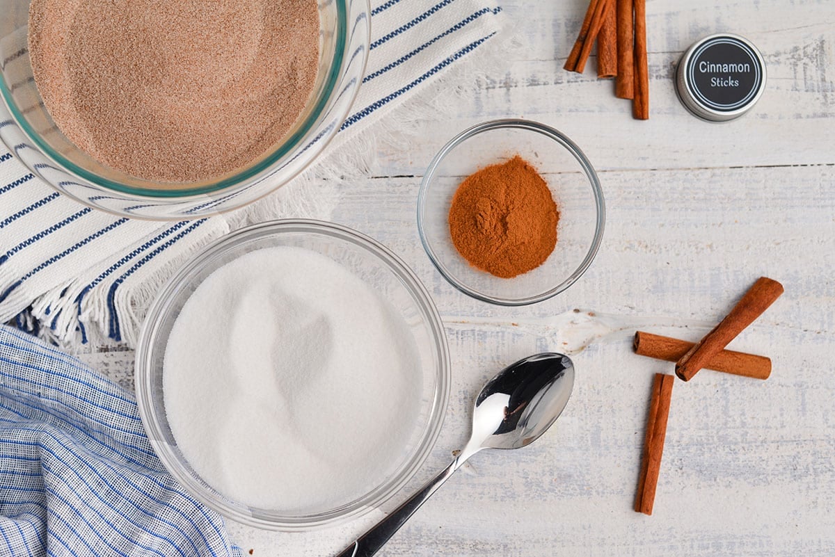 bowl of white sugar with cinnamon