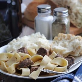 close up of crock pot beef and noodles on a plate