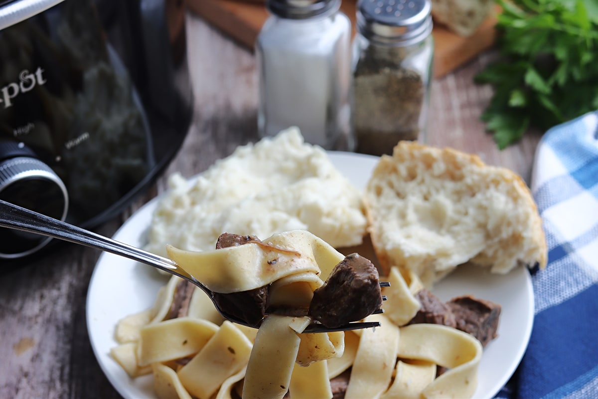 beef and noodles on a fork