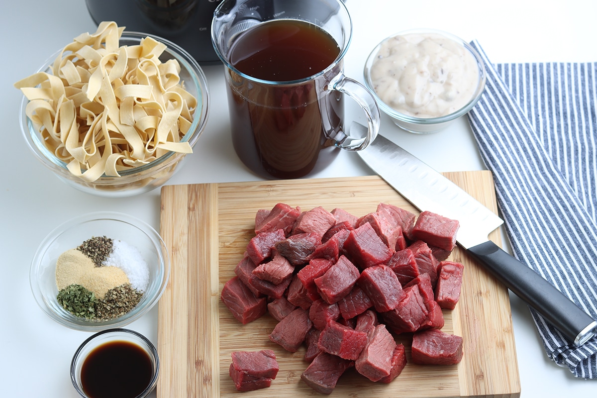 chuck roast cubed on a cutting board