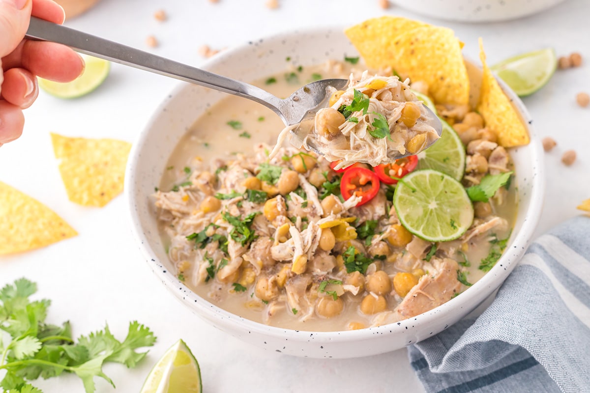 spoon holding white chicken chili