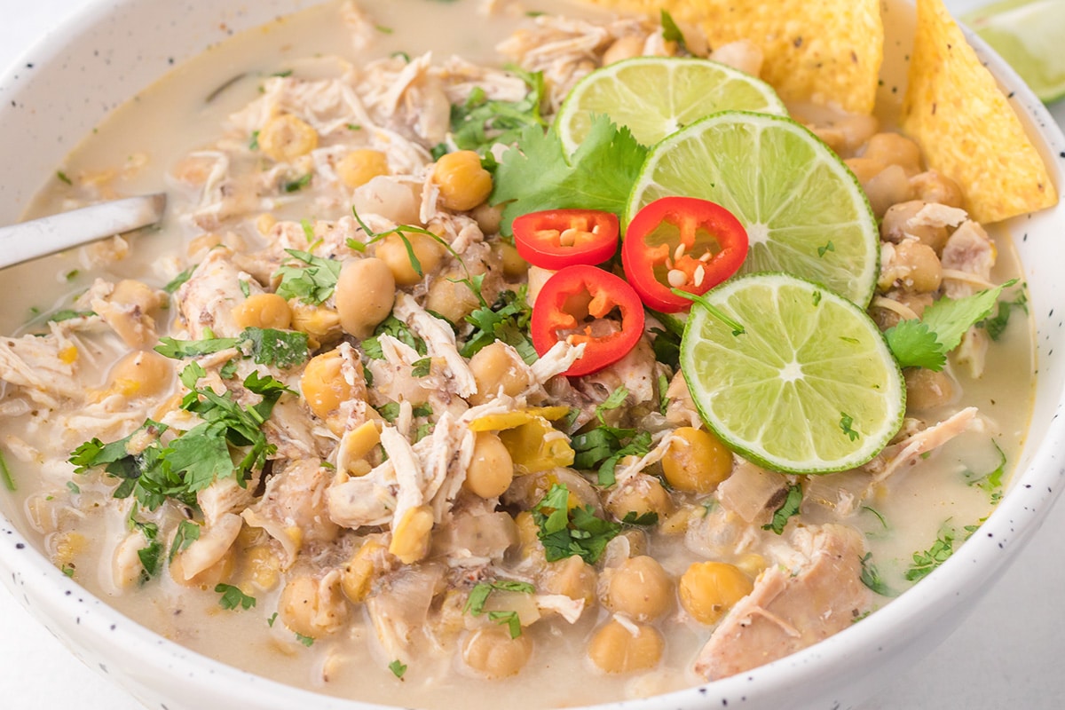 close up of white chicken chili in a bowl