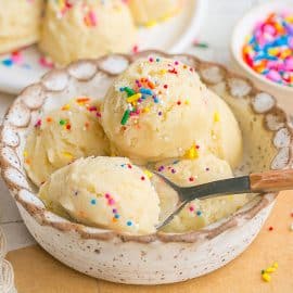 spoon in bowl of sugar cookie dough