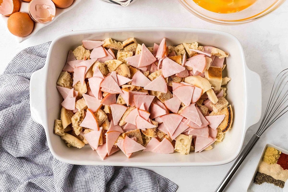 cut ham and english muffins in casserole dish