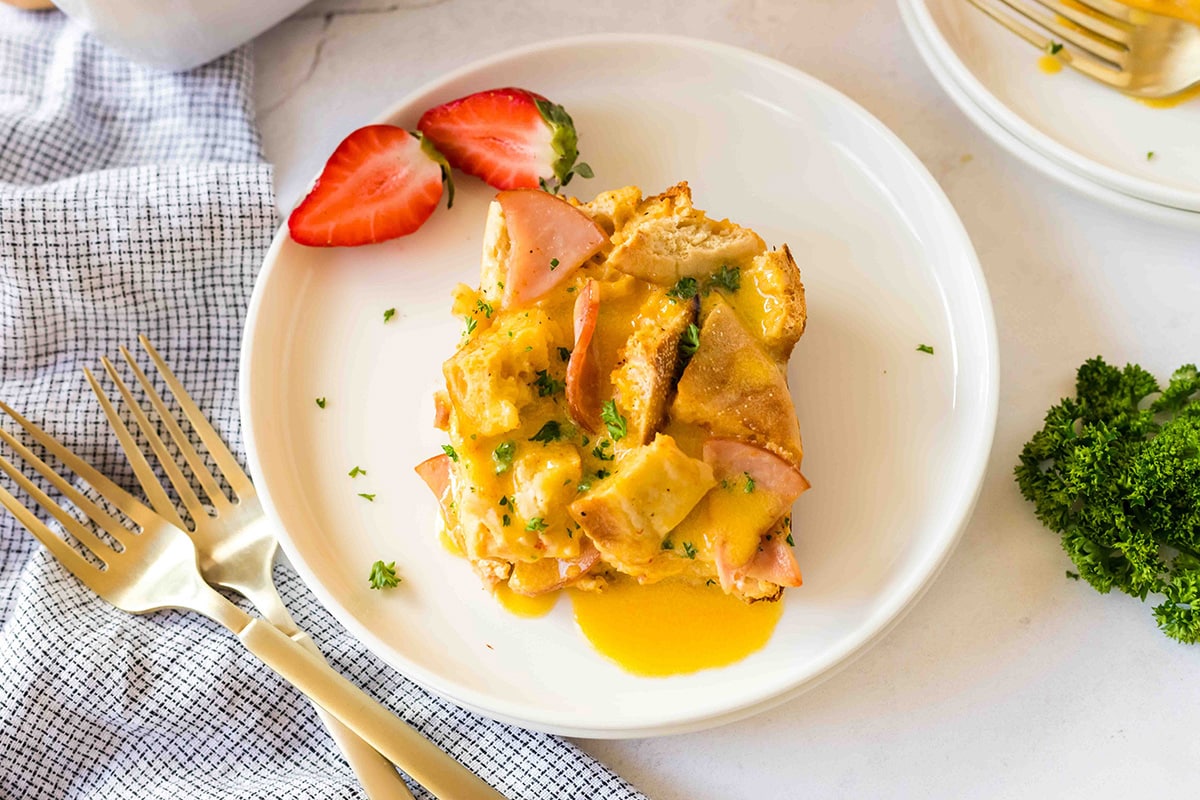 overhead shot of slice of eggs benedict casserole