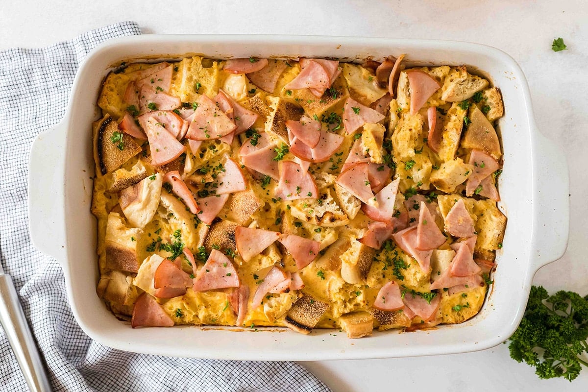 overhead shot of baked eggs benedict casserole