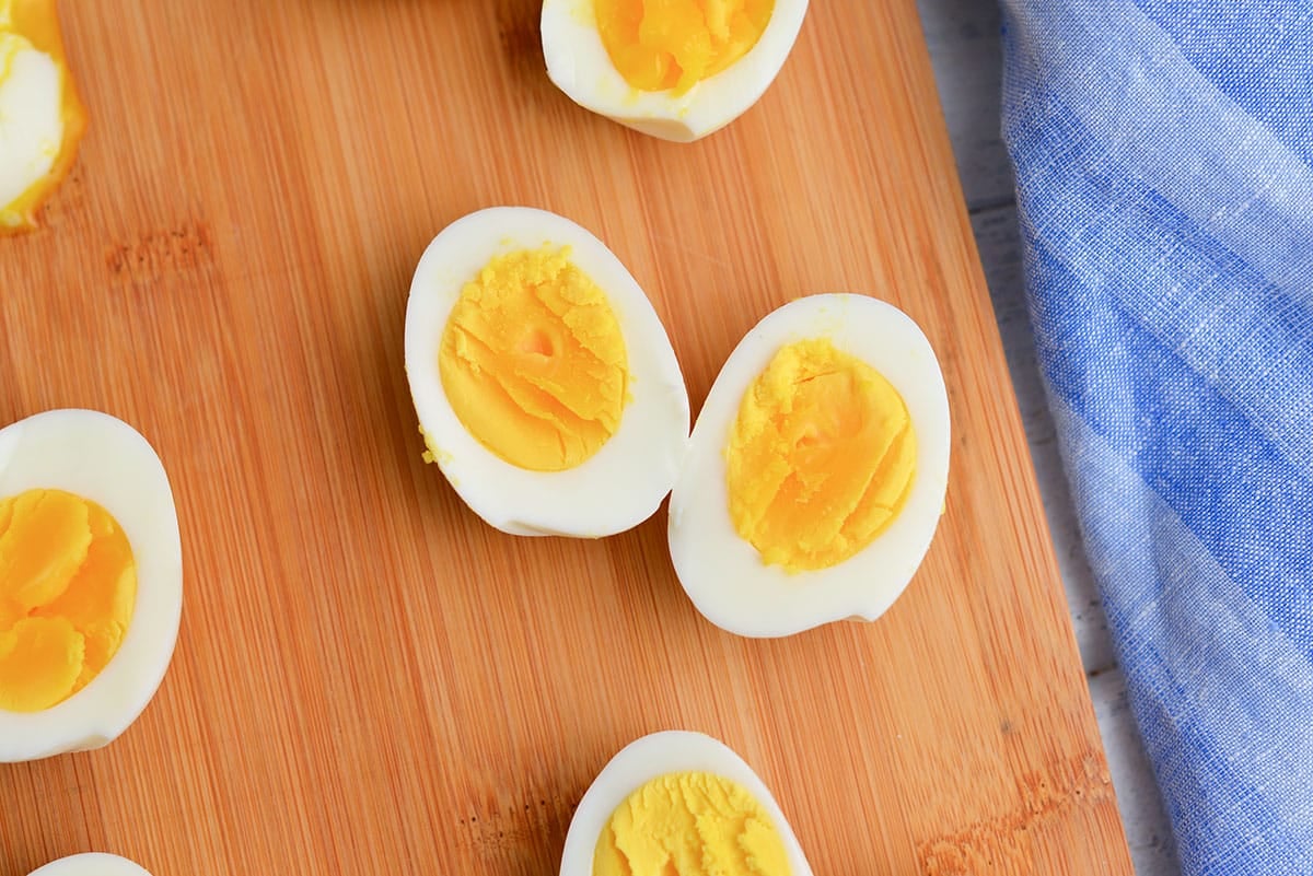 eight minute eggs on a wood cutting board