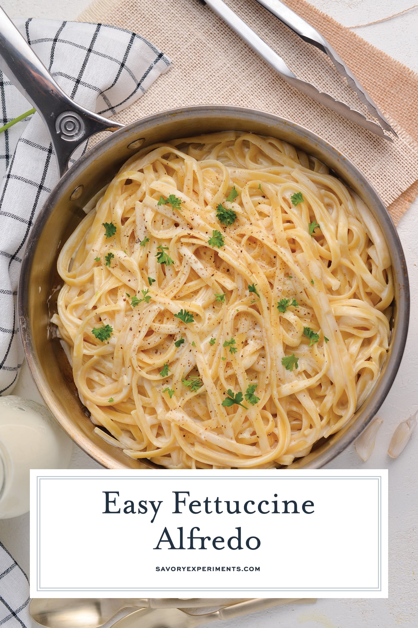 overhead shot of fettuccine alfredo in a pan with text overlay for pinterest