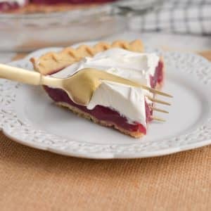 fork taking bite of grape juice pie