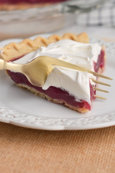 fork taking bite of grape juice pie