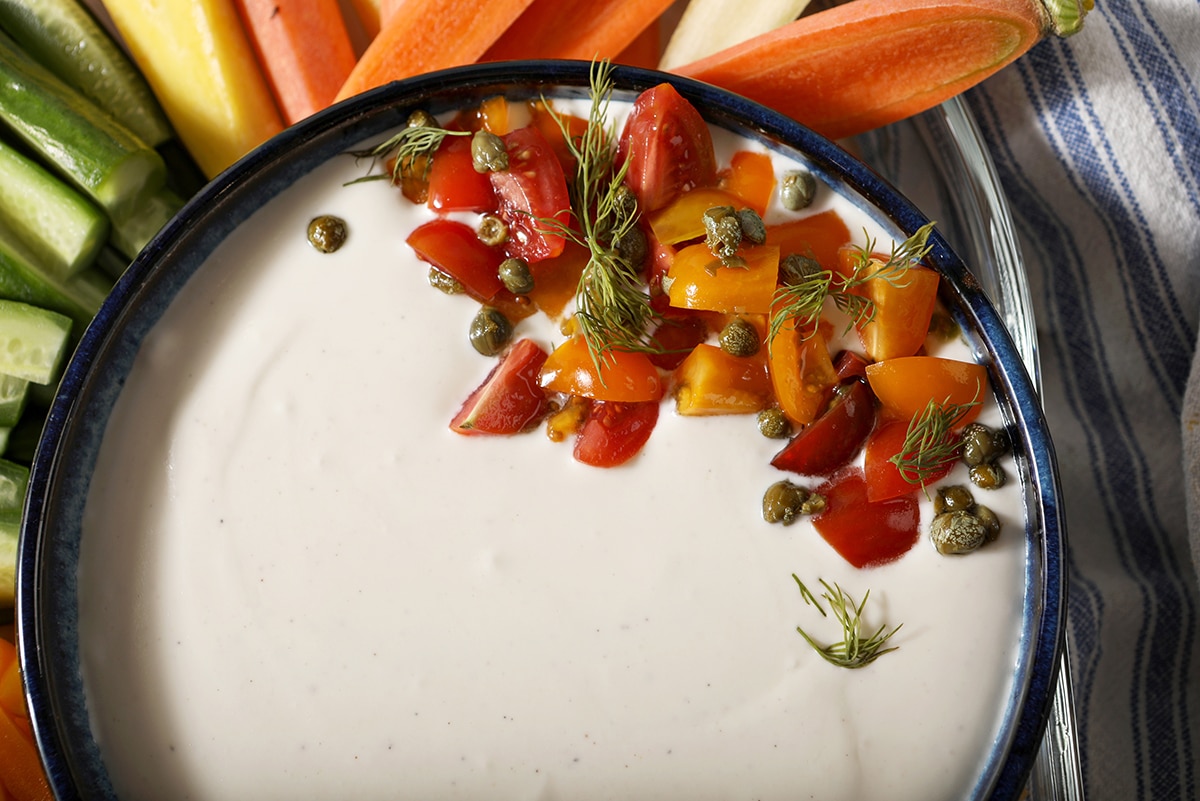 close up overhead shot of feta dip topped with tomatoes