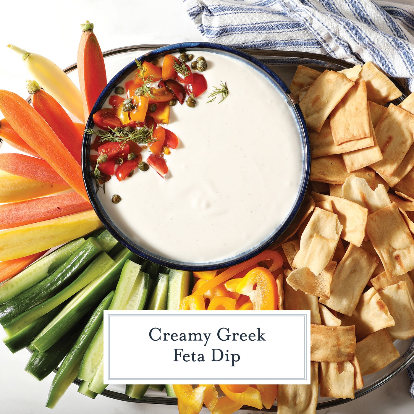 bowl of feta dip with dippers with text overlay for facebook