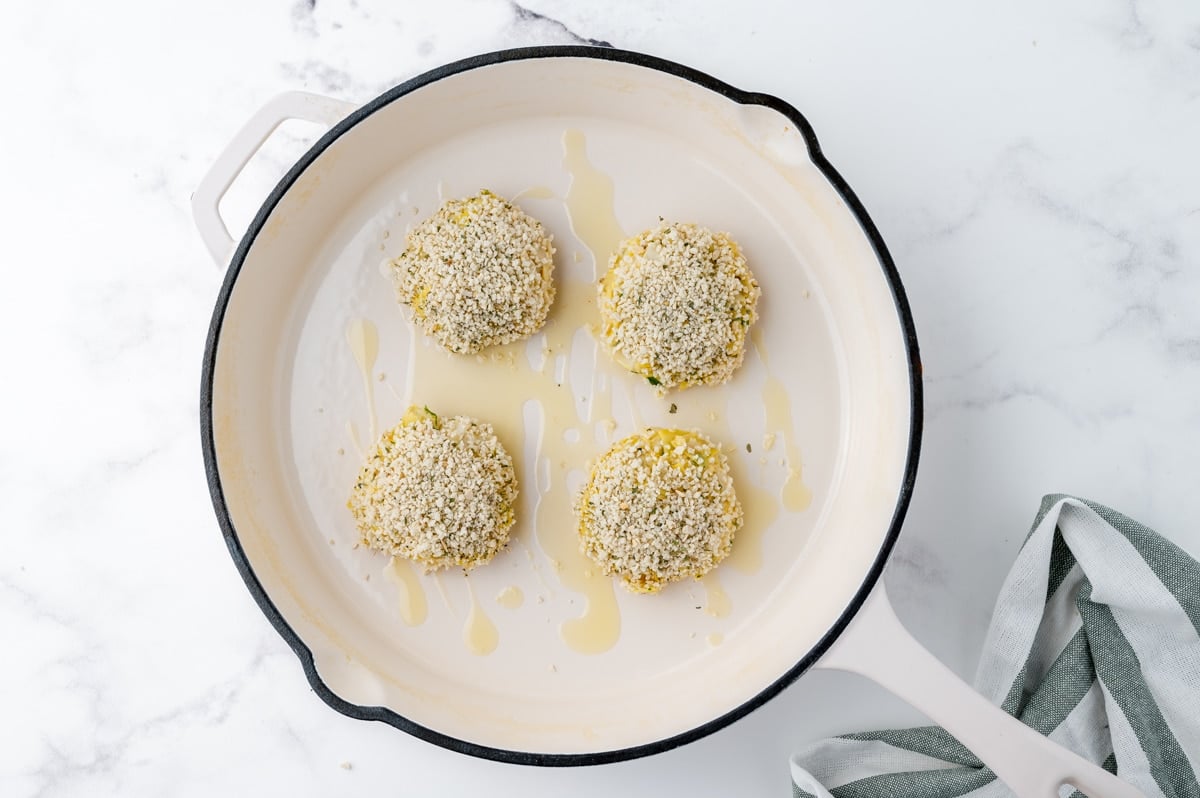 hearts of palm cakes frying in pan