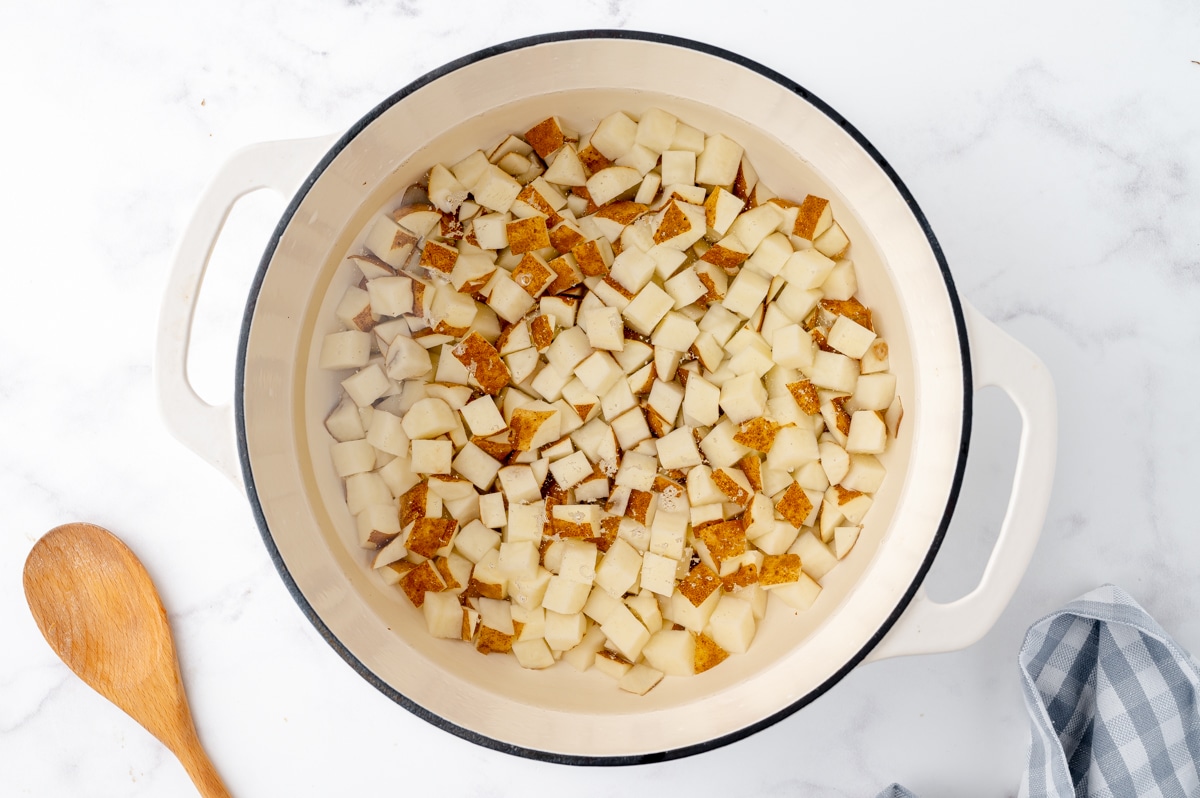 raw potato in a white ceramic bowl