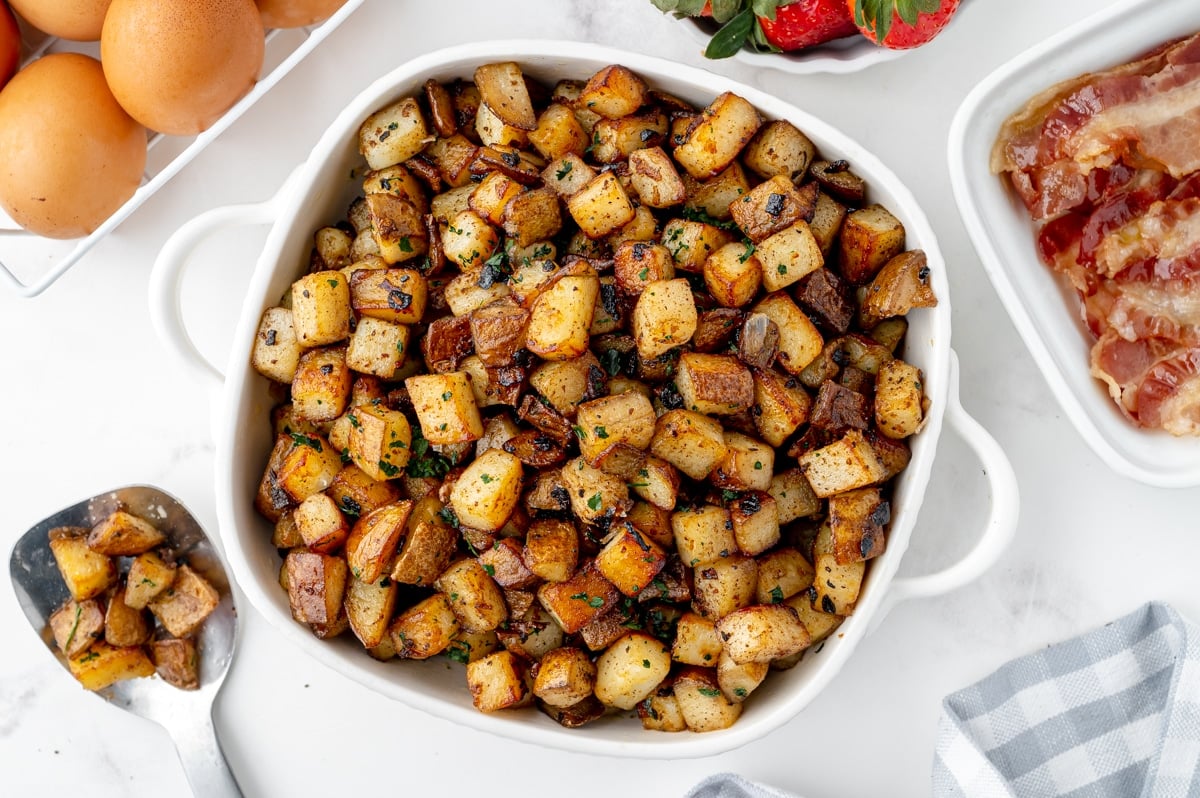 white serving bowl with fried potatoes