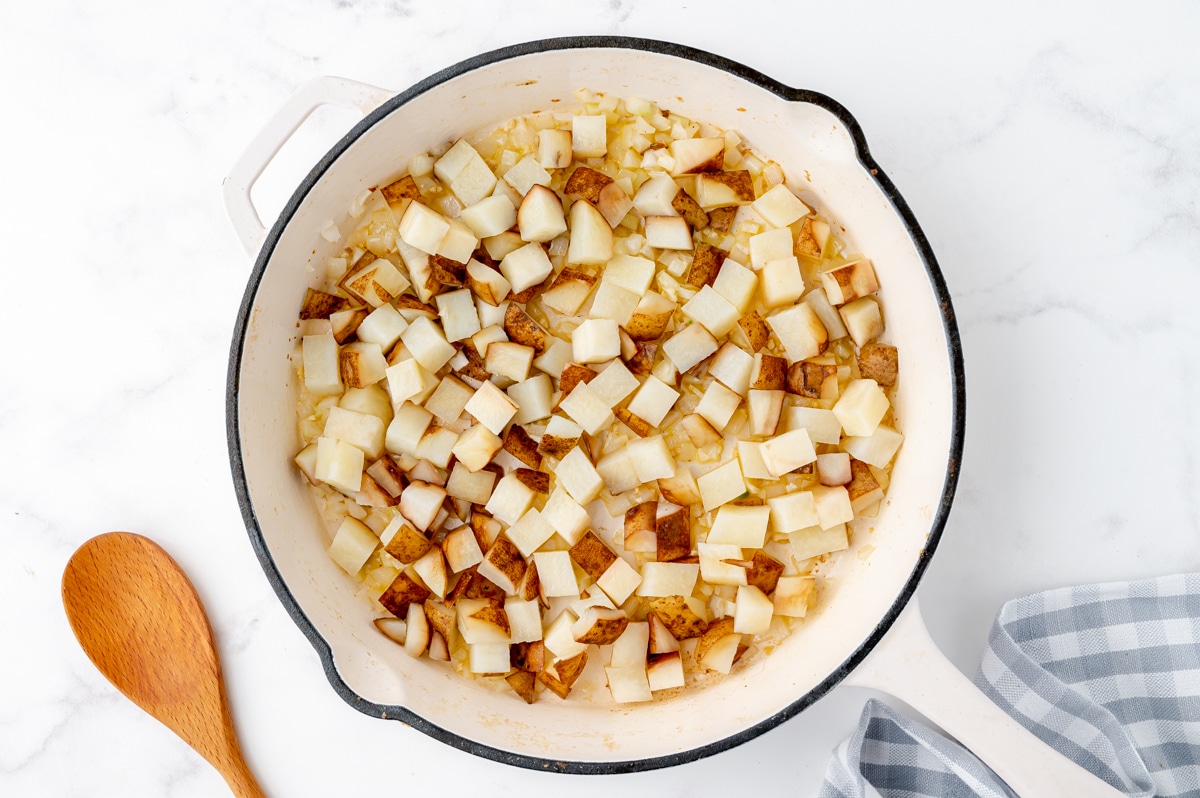 potatoes and in white ceramic frying pan