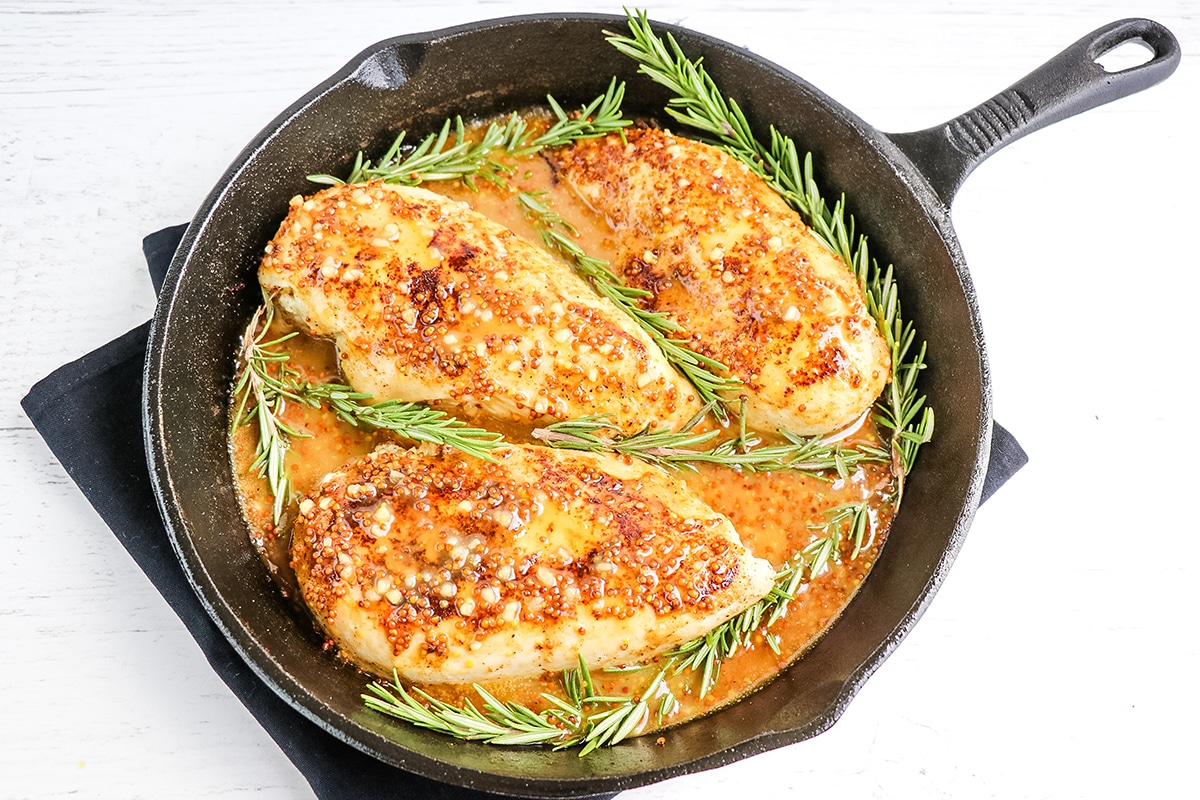 overhead shot of honey mustard chicken in skillet