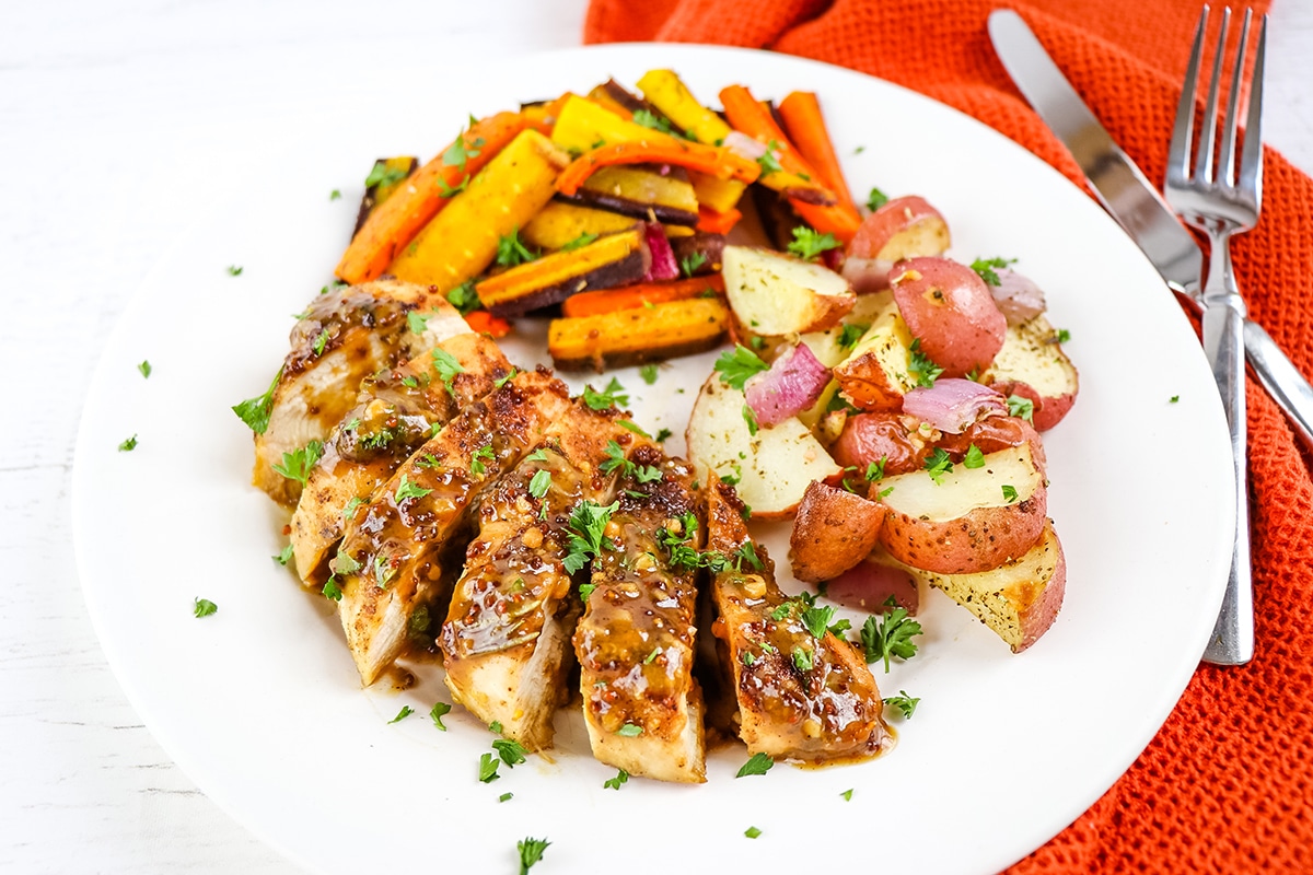 honey mustard chicken on a plate with veggies