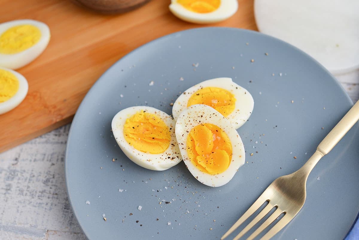 angle close up of eggs on a blue serving plate