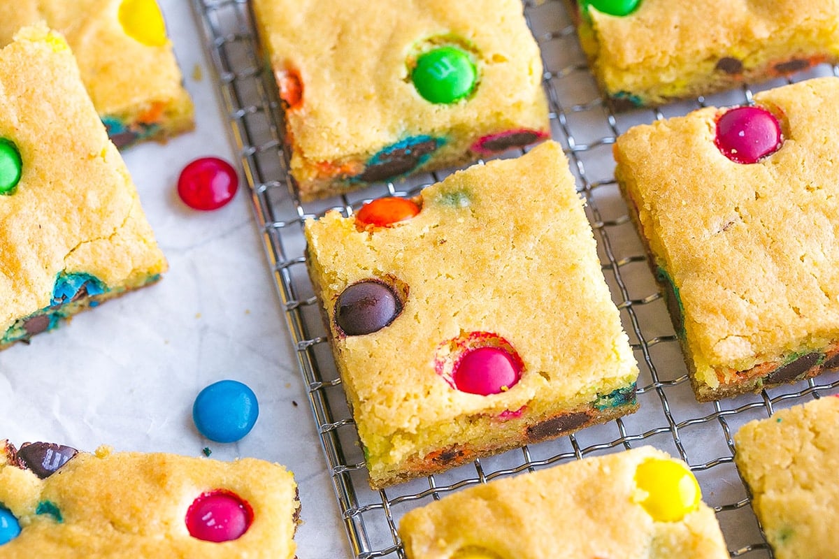m&m cookie bars on a cooling rack