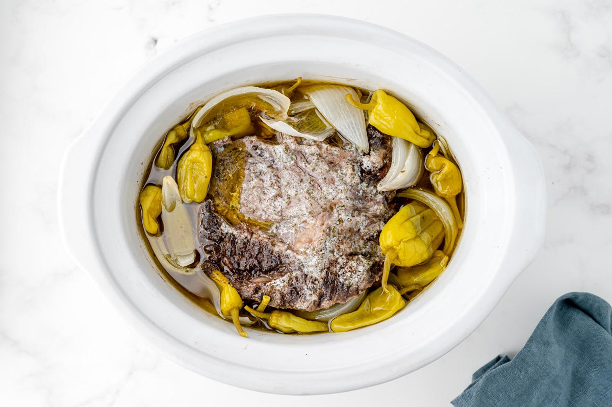 overhead shot of cooked mississippi pot roast in crock pot