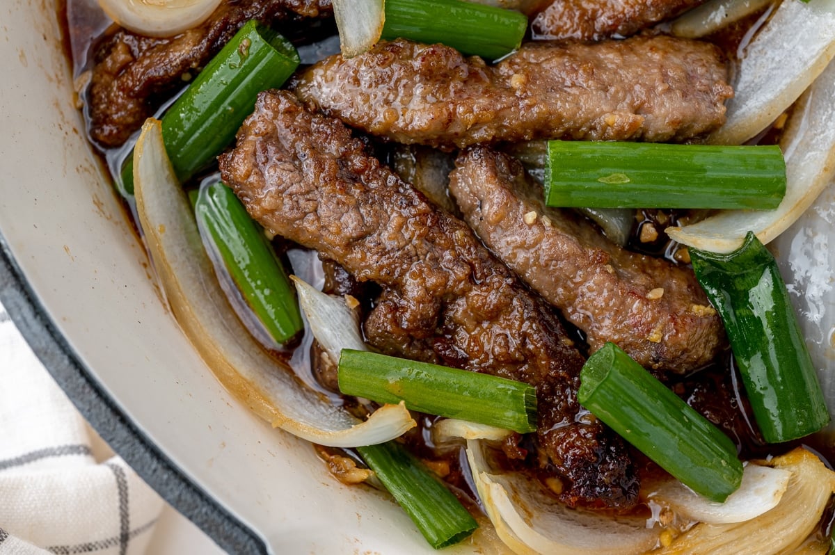 close up of monholian beef in a pan