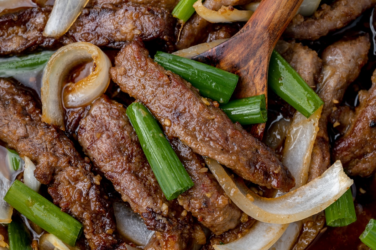 close up overhead shot of mongolian beef with onions
